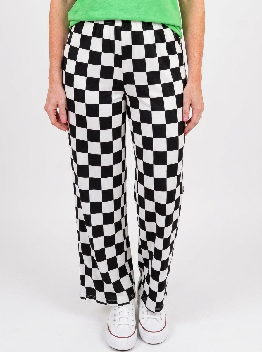 Black and white checkered wide leg pants on a white backdrop